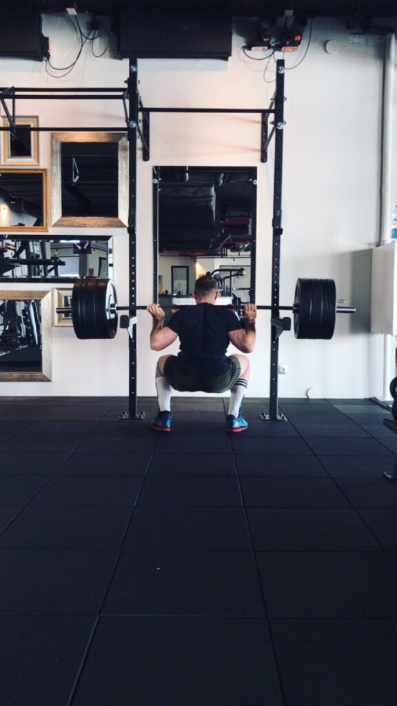 cyclist performing a squat