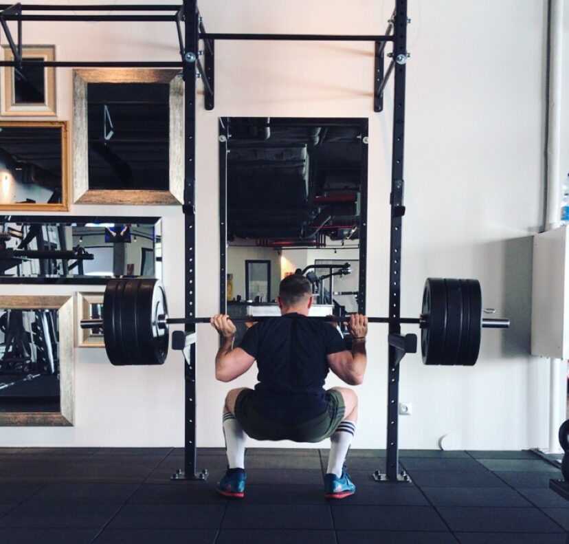 cyclist performing a squat