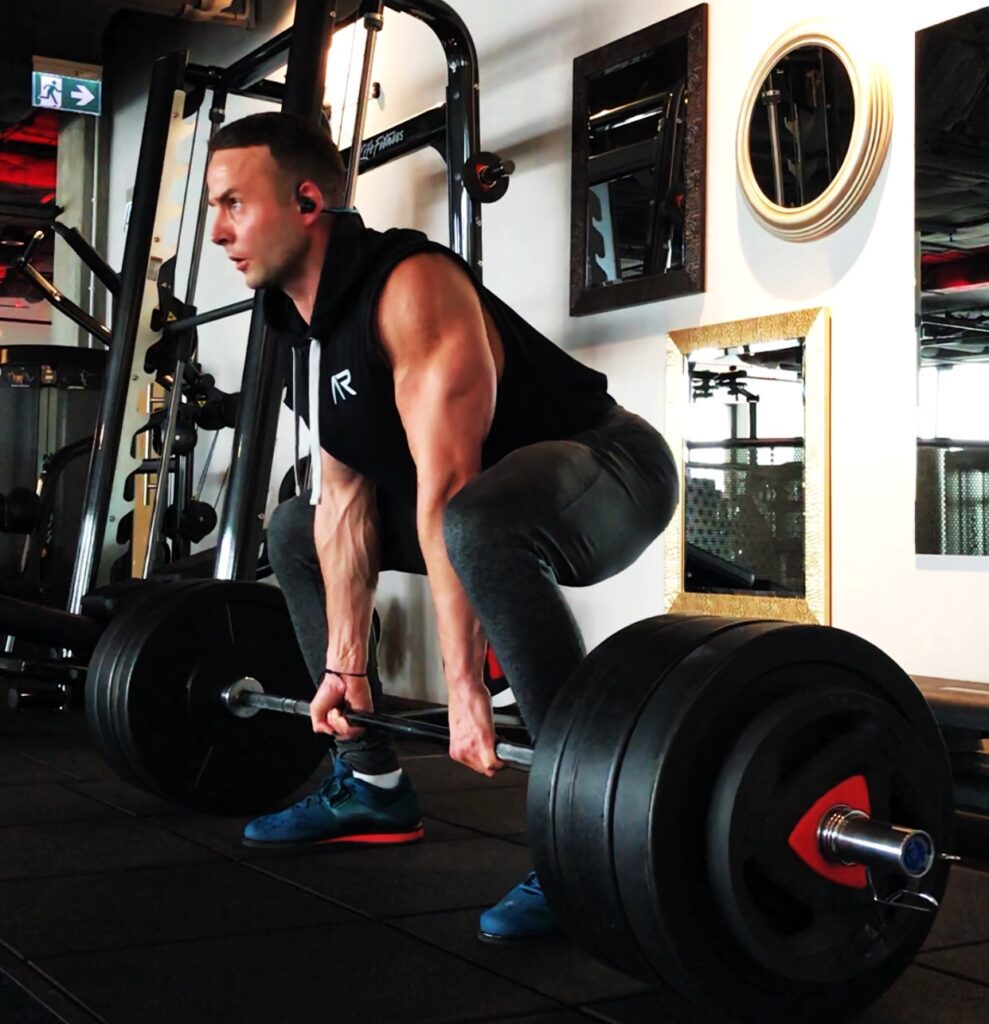 Cyclists performing deadlift